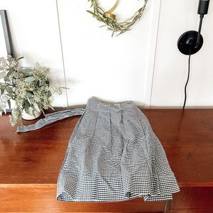 Black and white check cloth apron